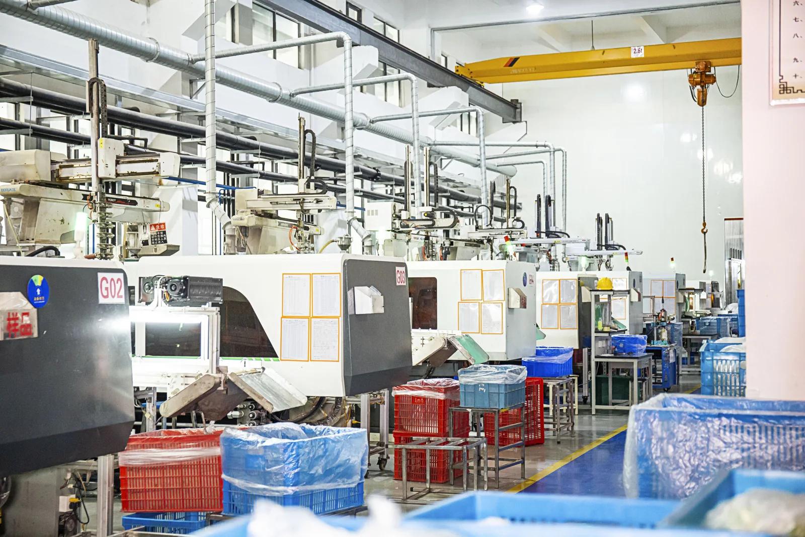 Row of injection molding machines in the Oulete workshop