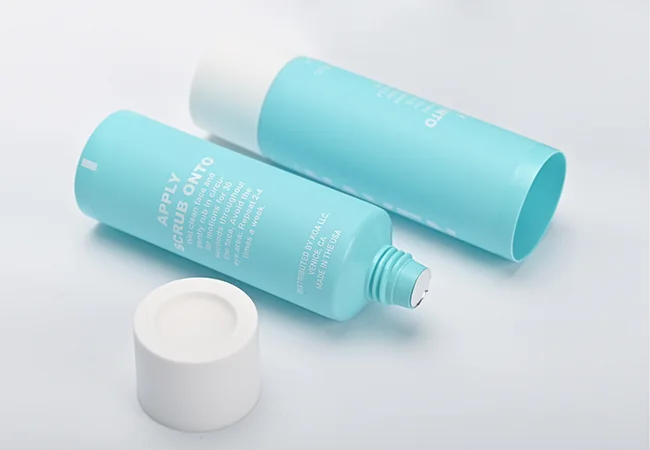 Turquoise cosmetic tube with a white cap